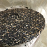 Silver Needle Tributary Puer Meng Hai Qiao Mu Ye Sheng Cha Pu'er 250g